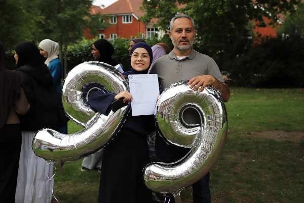 A student celebrates their results on GCSE Results Day 2025